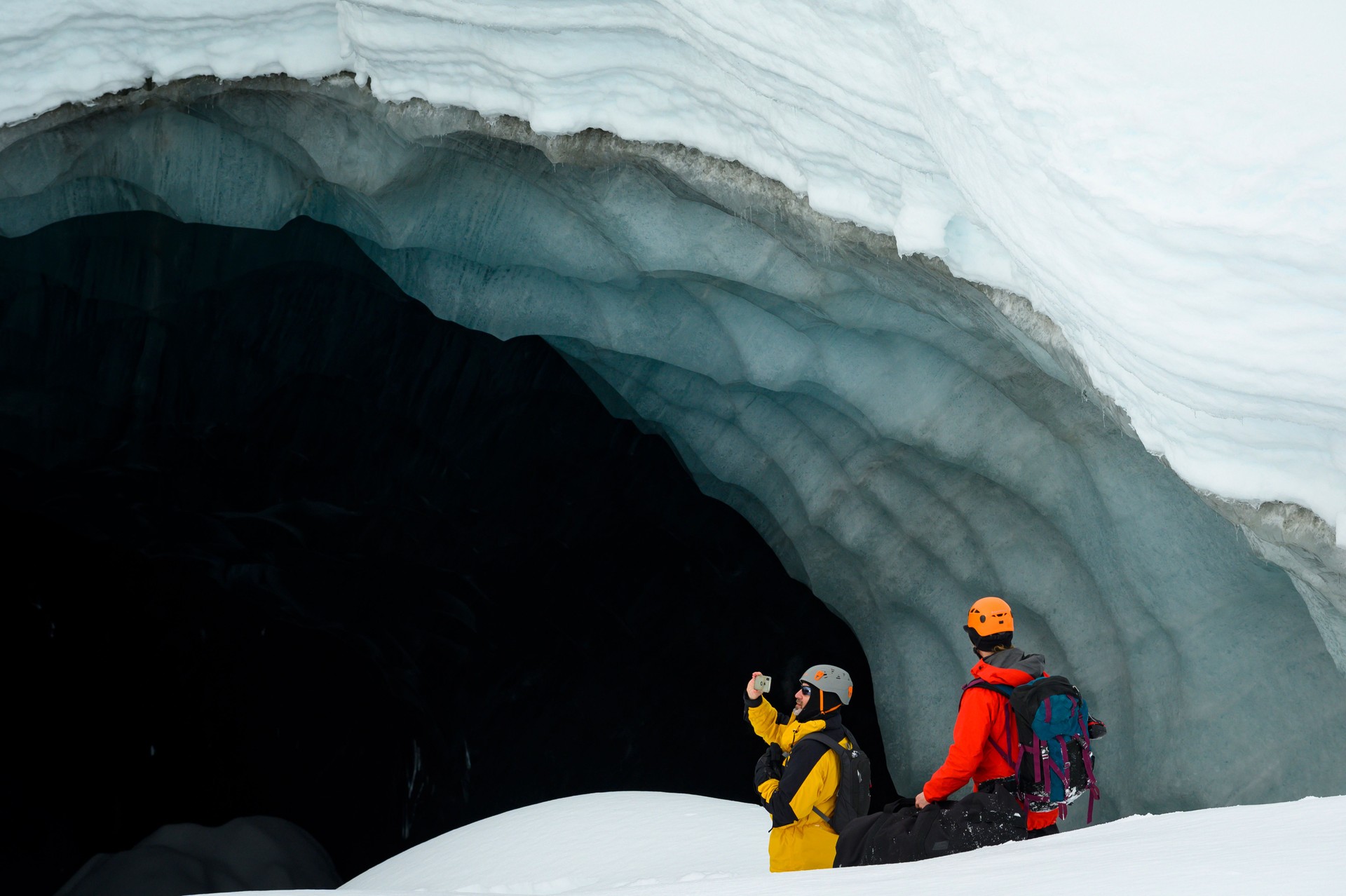 The guide leads visitors on a tour of the ice cave.